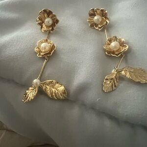 Beautiful gold and pearl drop earrings. Adds flair to every outfit.